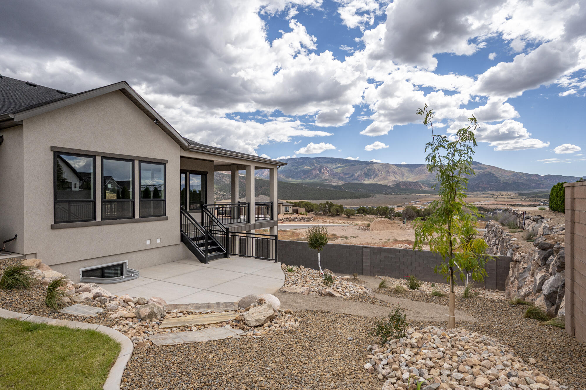 1852 South Hidden Canyon Road Cedar City, UT 84720 - Photo 65 of 79 A dedicated concrete patio provides the perfect spot for outdoor dining, barbecuing, relaxing, or gathering around a future fire pit.