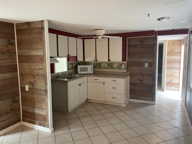 156 County Road Big Pine Key, FL 33043 - Photo 11 of 15 a bathroom with a granite countertop sink mirror and shower