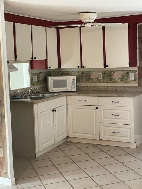 156 County Road Big Pine Key, FL 33043 - Photo 12 of 15 a kitchen with a sink and cabinets