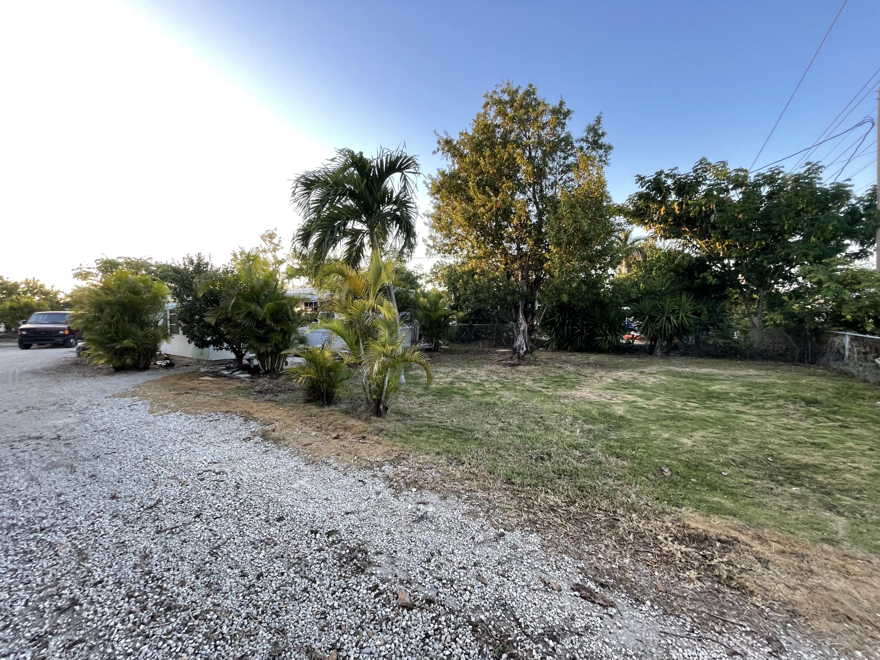 156 County Road Big Pine Key, FL 33043 - Photo 3 of 15 a view of a field with trees in the background