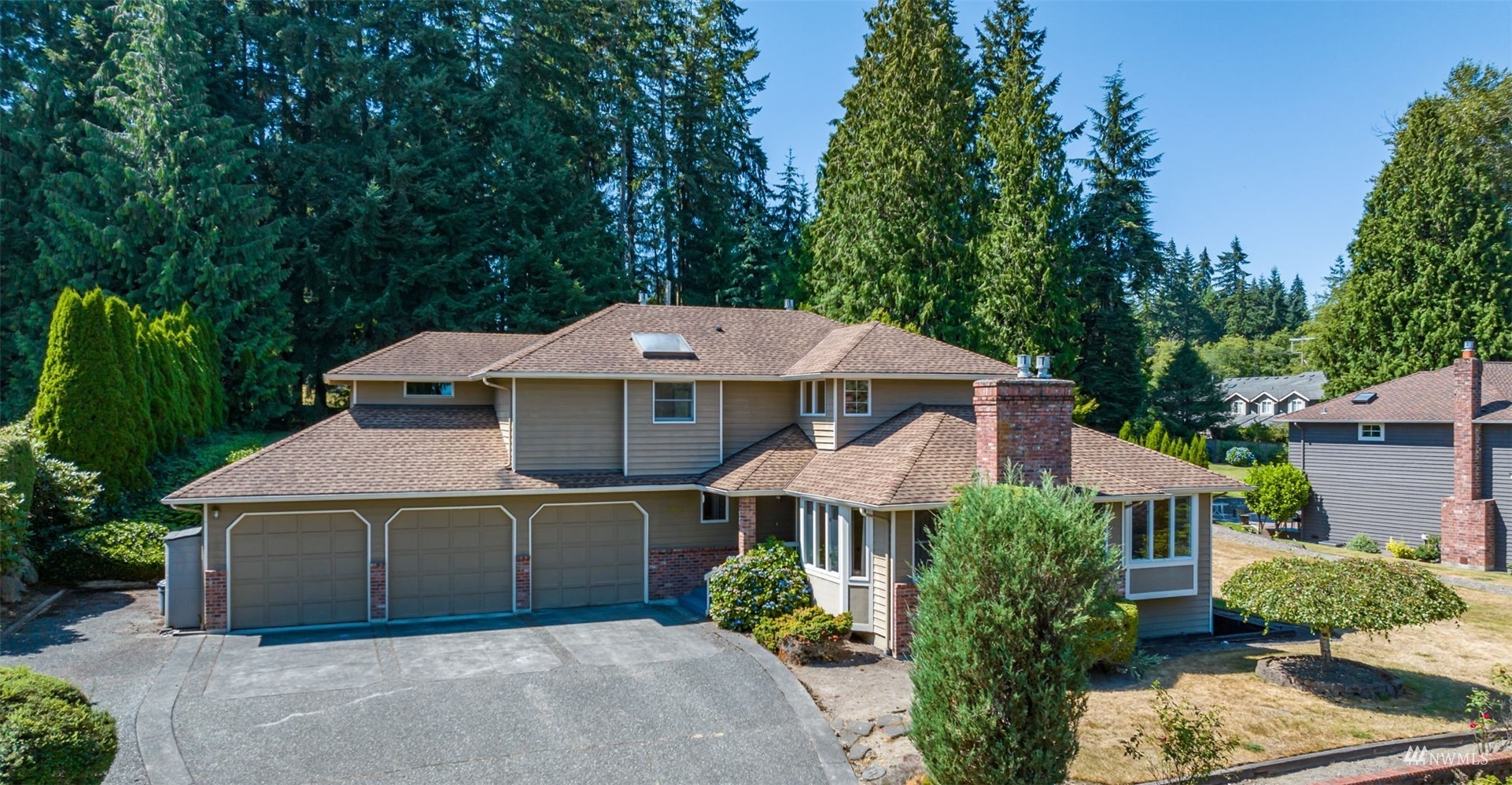 21032 47th Drive Southeast Bothell, WA 98021 - Photo 1 of 1 a front view of a house with a yard and garage