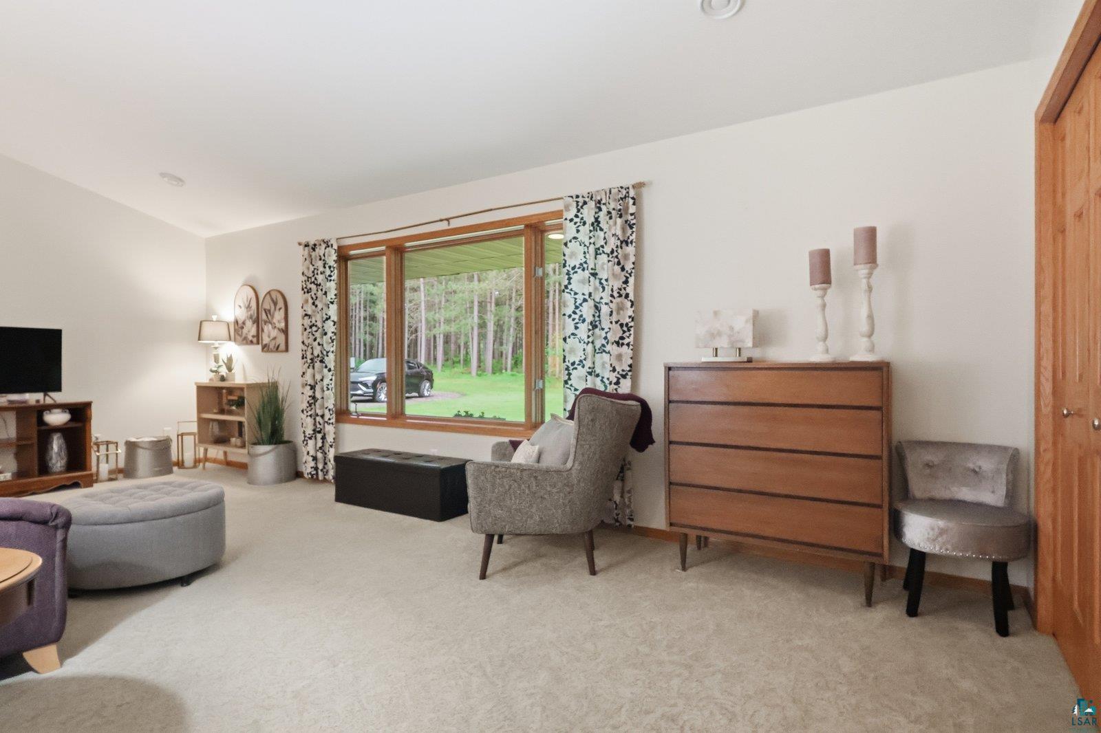41 East Stark Road Esko, MN 55733 - Photo 5 of 19 Spacious living area featuring light-toned carpeting and vaulted ceilings
