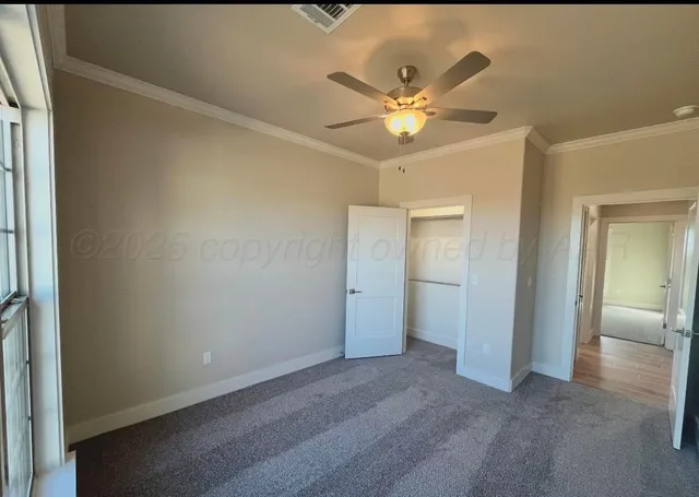 a view of a chandelier fan and a livingroom