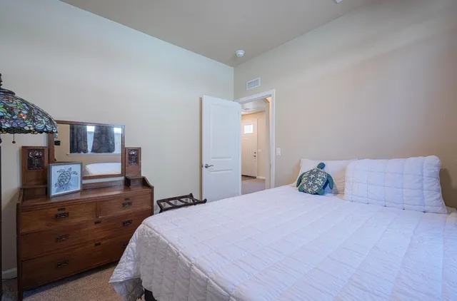 a view of staircase with door and wooden floor