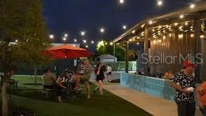 a view of a chairs and table in backyard