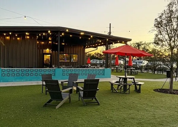 a patio with a patio table and chairs