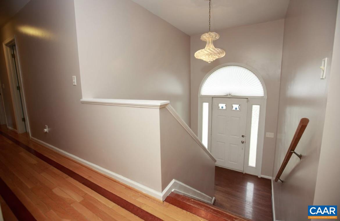 166 Oak View Road Barboursville, VA 22923 - Photo 24 of 46 a view of a hallway with wooden floor and staircase