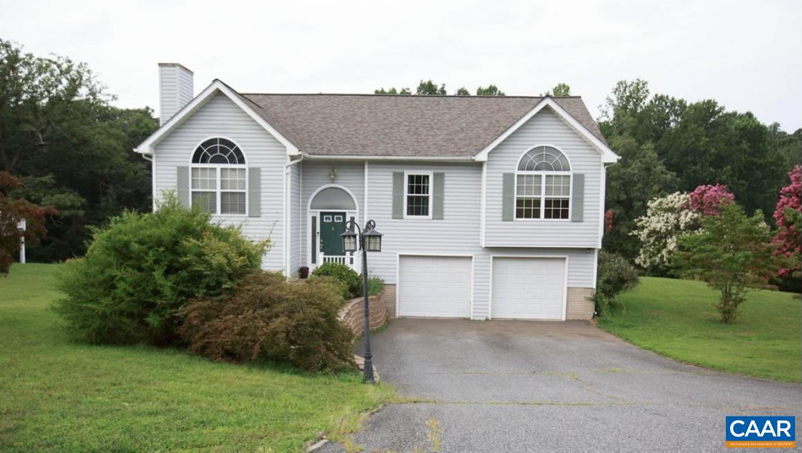 166 Oak View Road Barboursville, VA 22923 - Photo 7 of 46 a front view of a house with a yard and garage