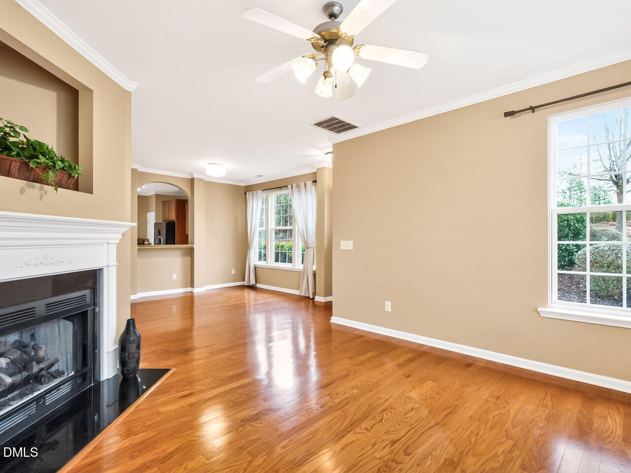 102 Grey Elm Trail Durham, NC 27713 - Photo 11 of 38 a view of livingroom with window fireplace and wooden floor