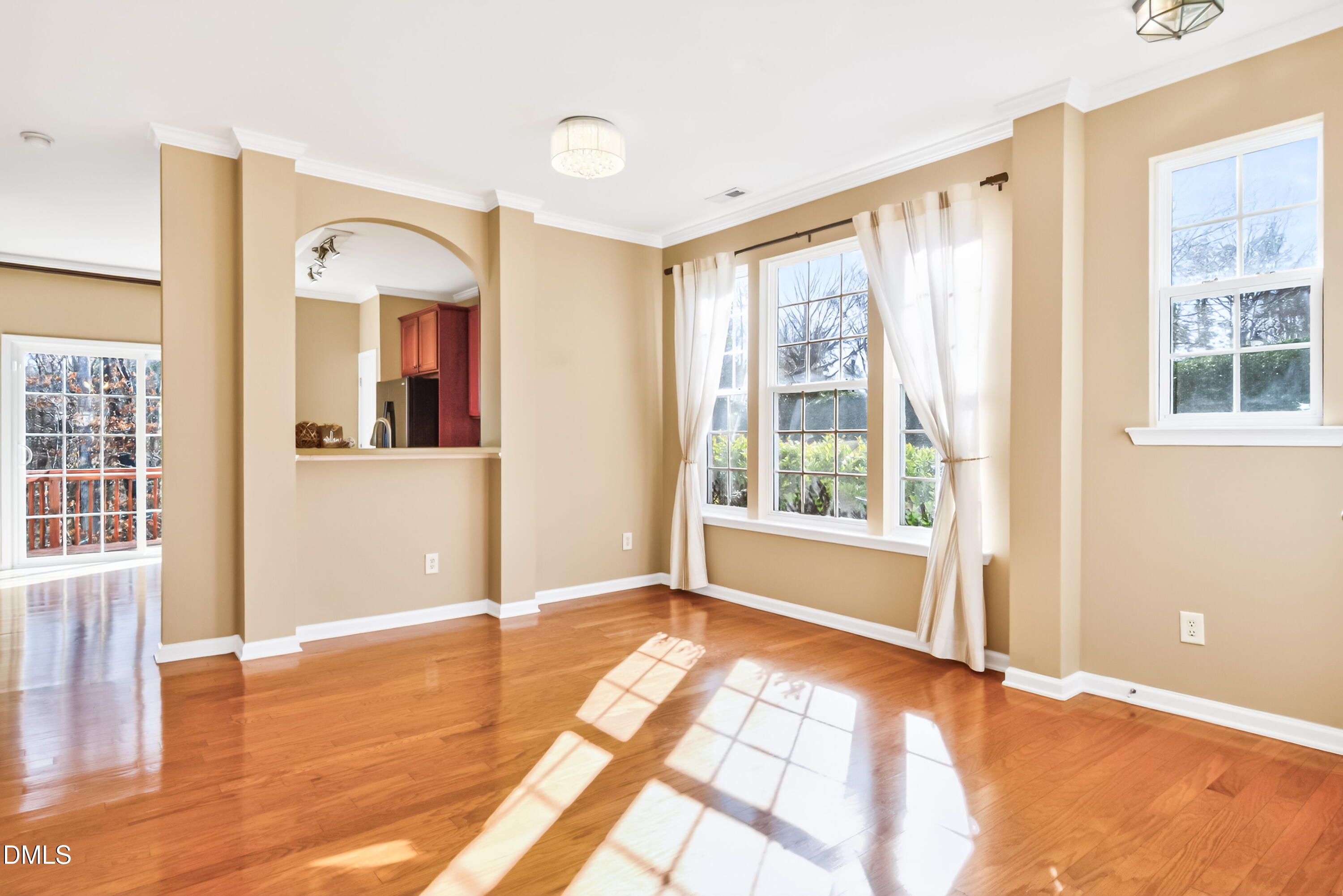 102 Grey Elm Trail Durham, NC 27713 - Photo 14 of 38 an empty room with wooden floor and windows