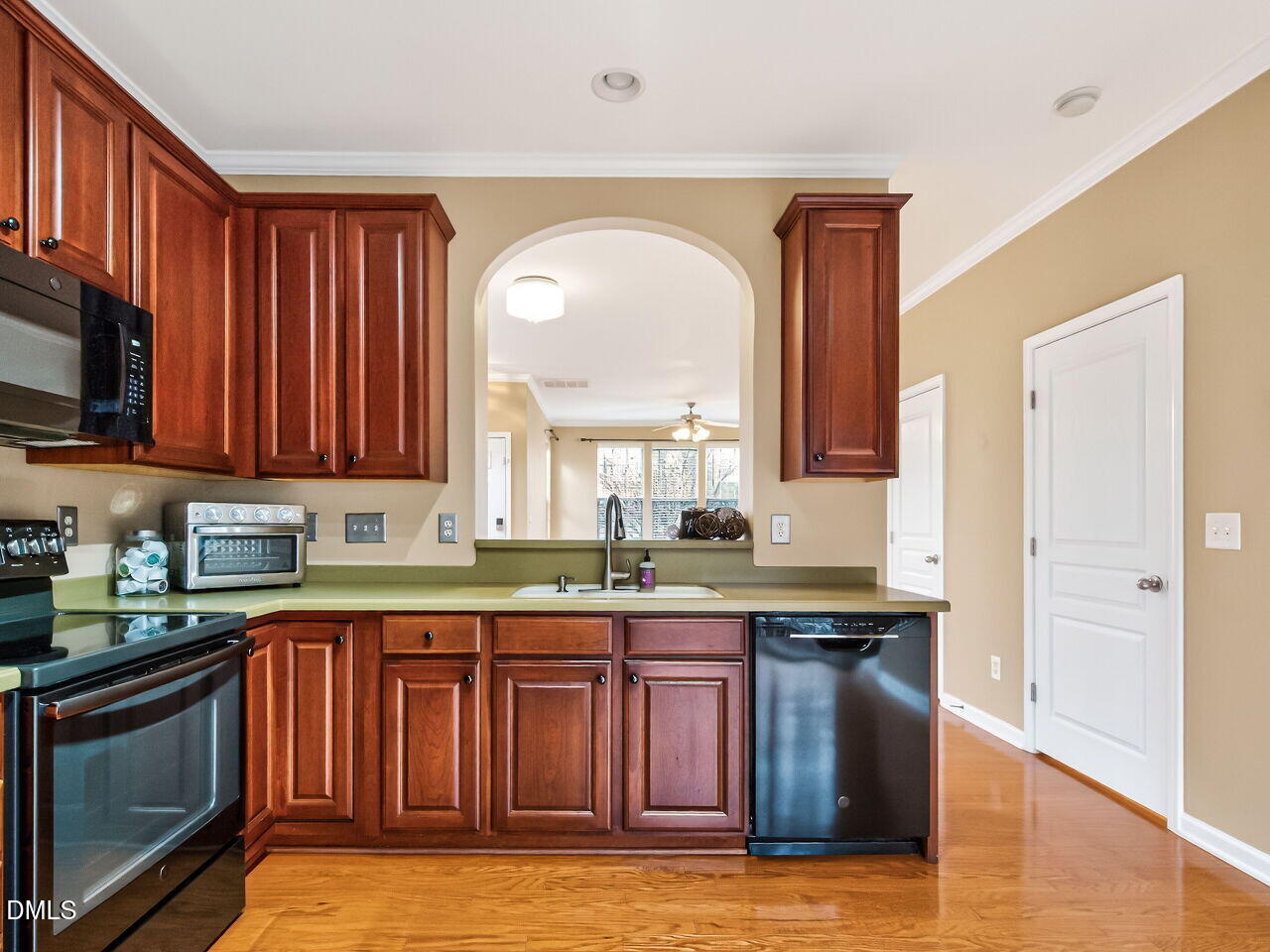 102 Grey Elm Trail Durham, NC 27713 - Photo 17 of 38 a kitchen with stainless steel appliances granite countertop wooden cabinets a sink and dishwasher