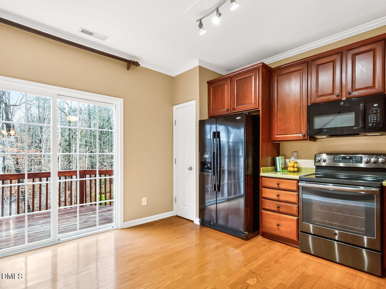 102 Grey Elm Trail Durham, NC 27713 - Photo 18 of 38 a kitchen with stainless steel appliances granite countertop a refrigerator and a stove top oven