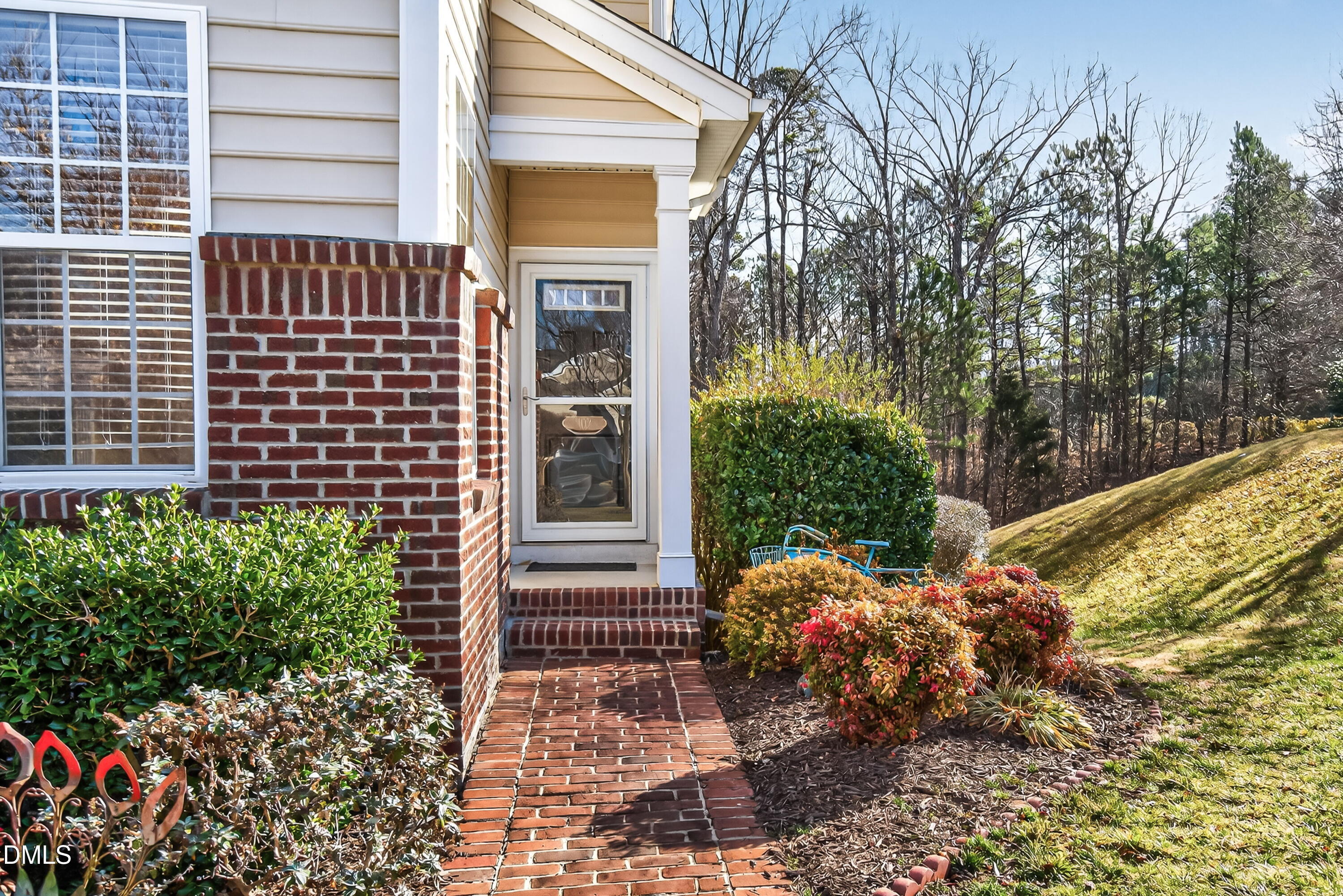102 Grey Elm Trail Durham, NC 27713 - Photo 2 of 38 a view of a house with a flower garden