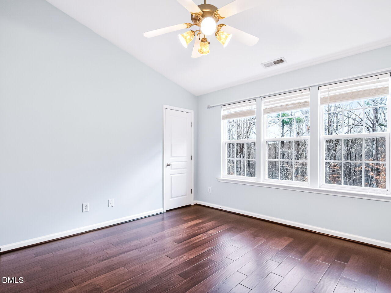 102 Grey Elm Trail Durham, NC 27713 - Photo 21 of 38 a view of an empty room with a window and wooden floor