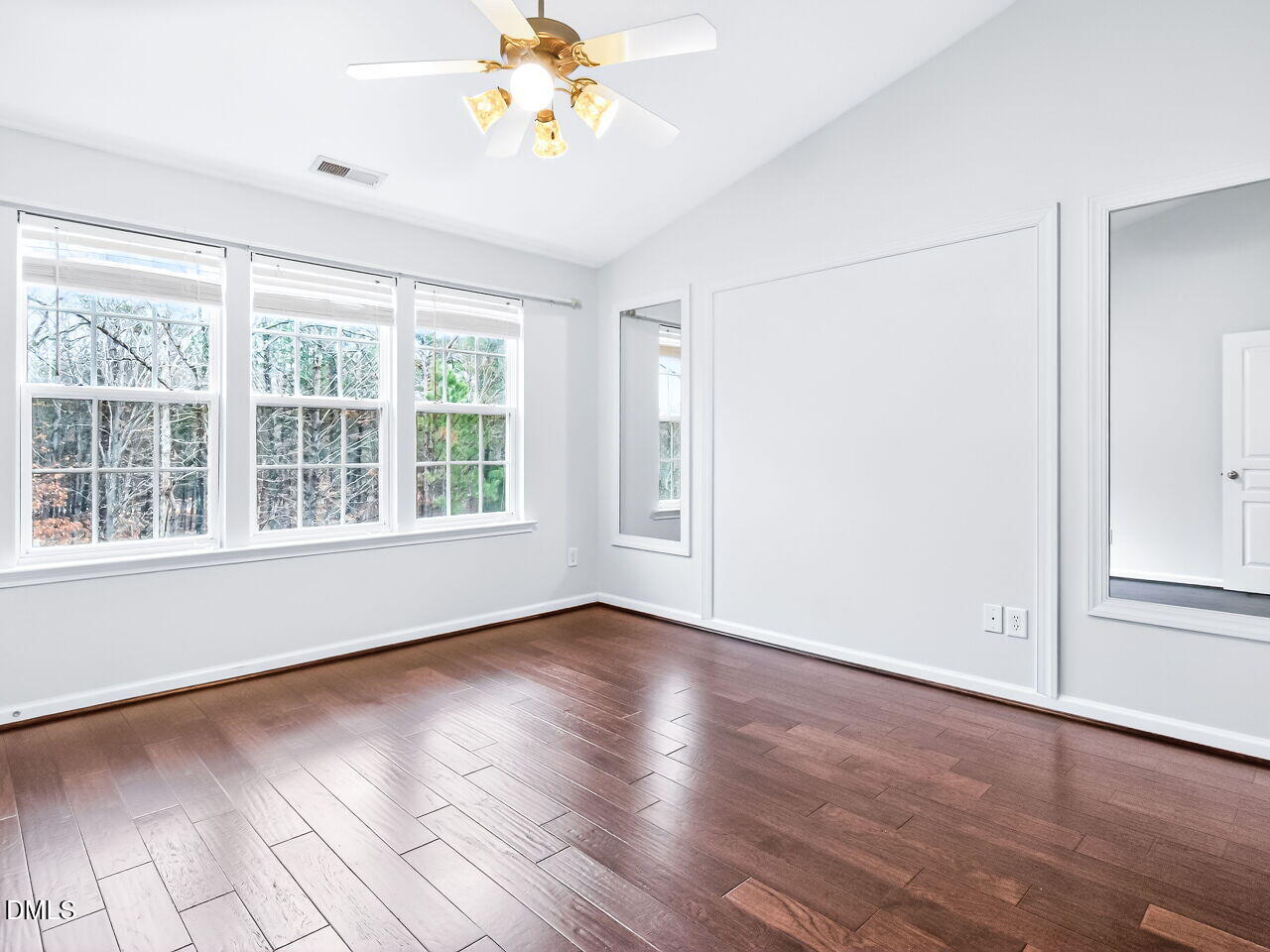 102 Grey Elm Trail Durham, NC 27713 - Photo 22 of 38 a view of an empty room with wooden floor and a window