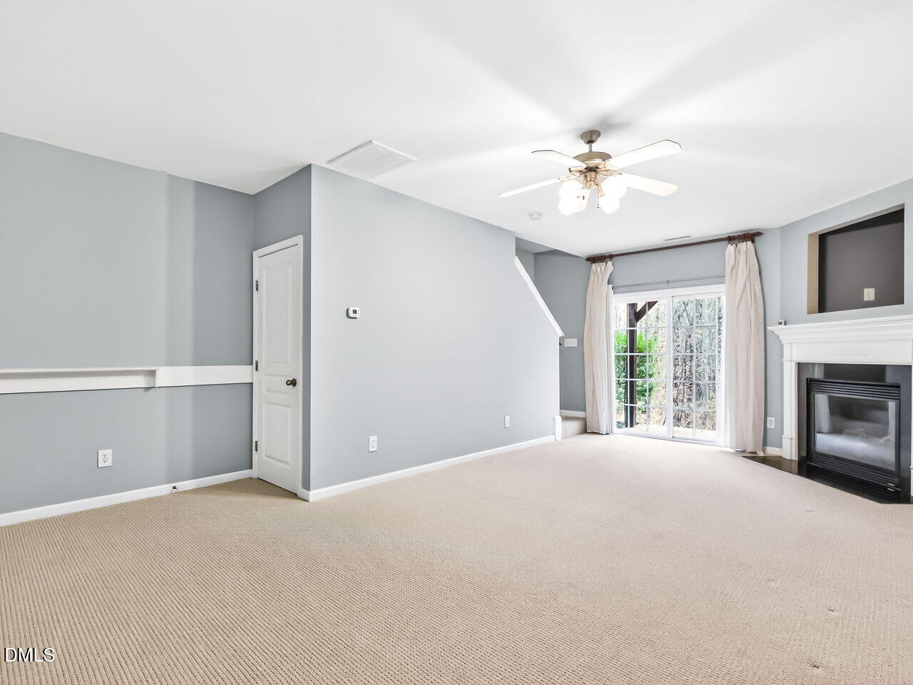 102 Grey Elm Trail Durham, NC 27713 - Photo 27 of 38 a view of a livingroom with a fireplace and chandelier fan
