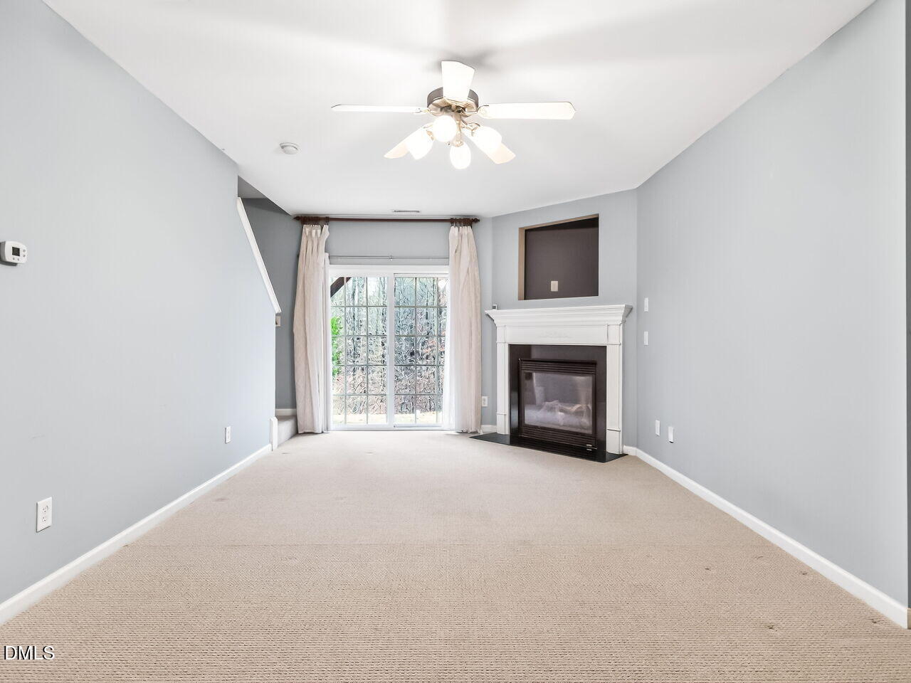 102 Grey Elm Trail Durham, NC 27713 - Photo 28 of 38 a view of an empty room with a fireplace and a window