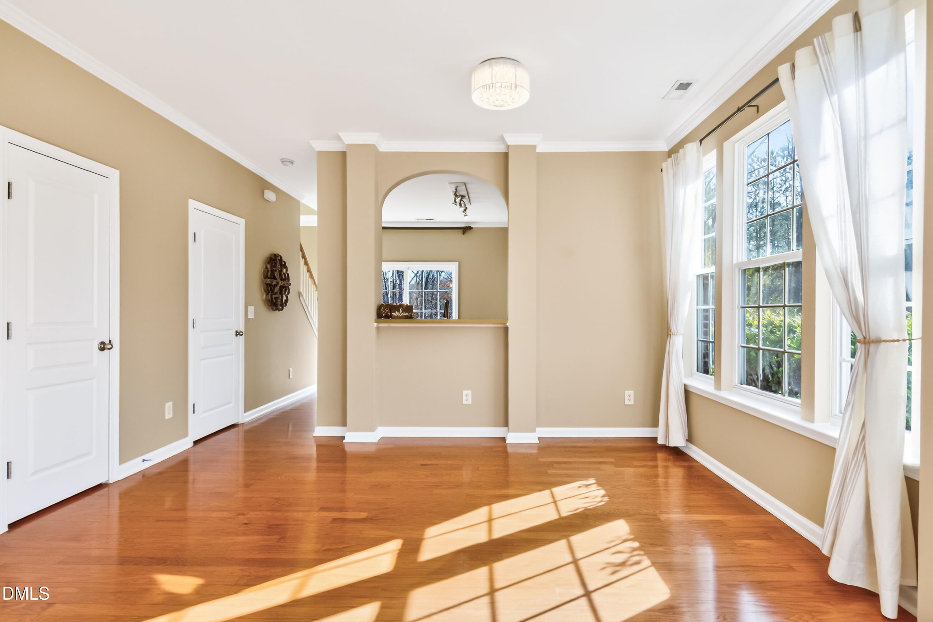 102 Grey Elm Trail Durham, NC 27713 - Photo 4 of 38 a view of a hallway with wooden floor and a living room