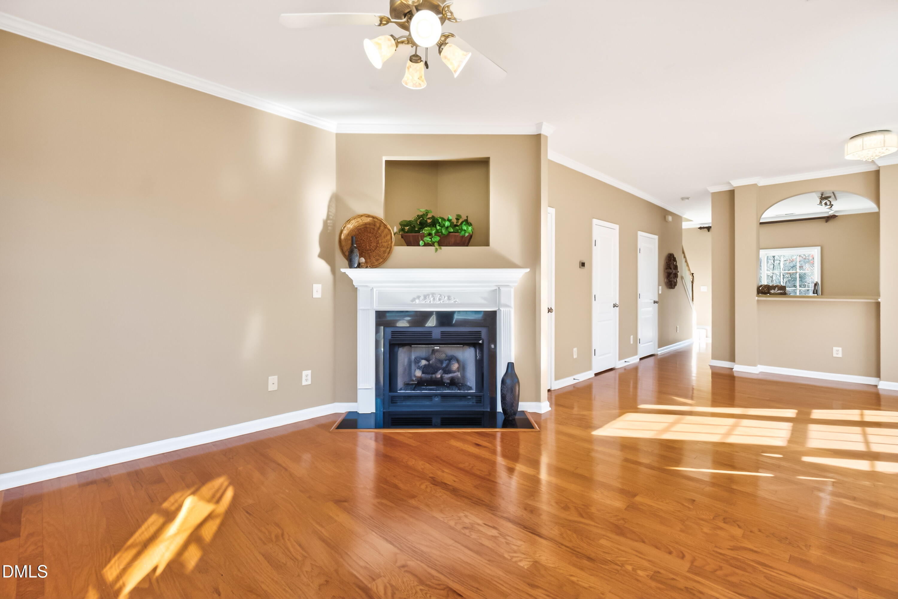 102 Grey Elm Trail Durham, NC 27713 - Photo 10 of 38 a view of an empty room with a fireplace and wooden floor