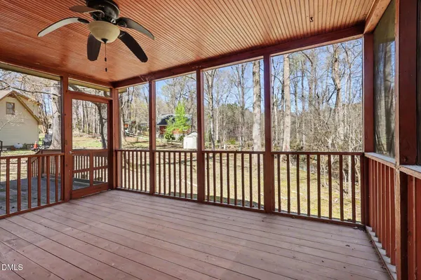 a view of a balcony with wooden floor
