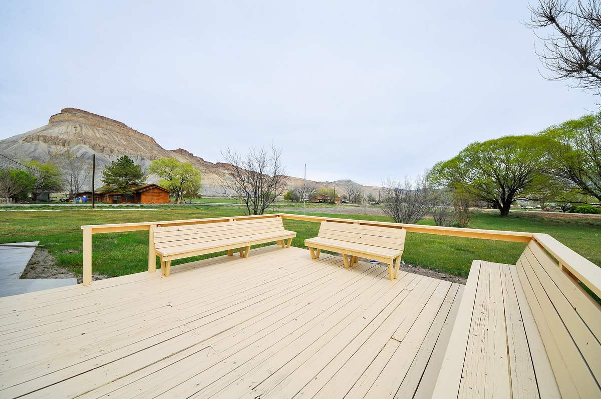3453 1/2 G Road Clifton, CO 81520 - Photo 14 of 21 a view of deck with lawn chairs and a large tree