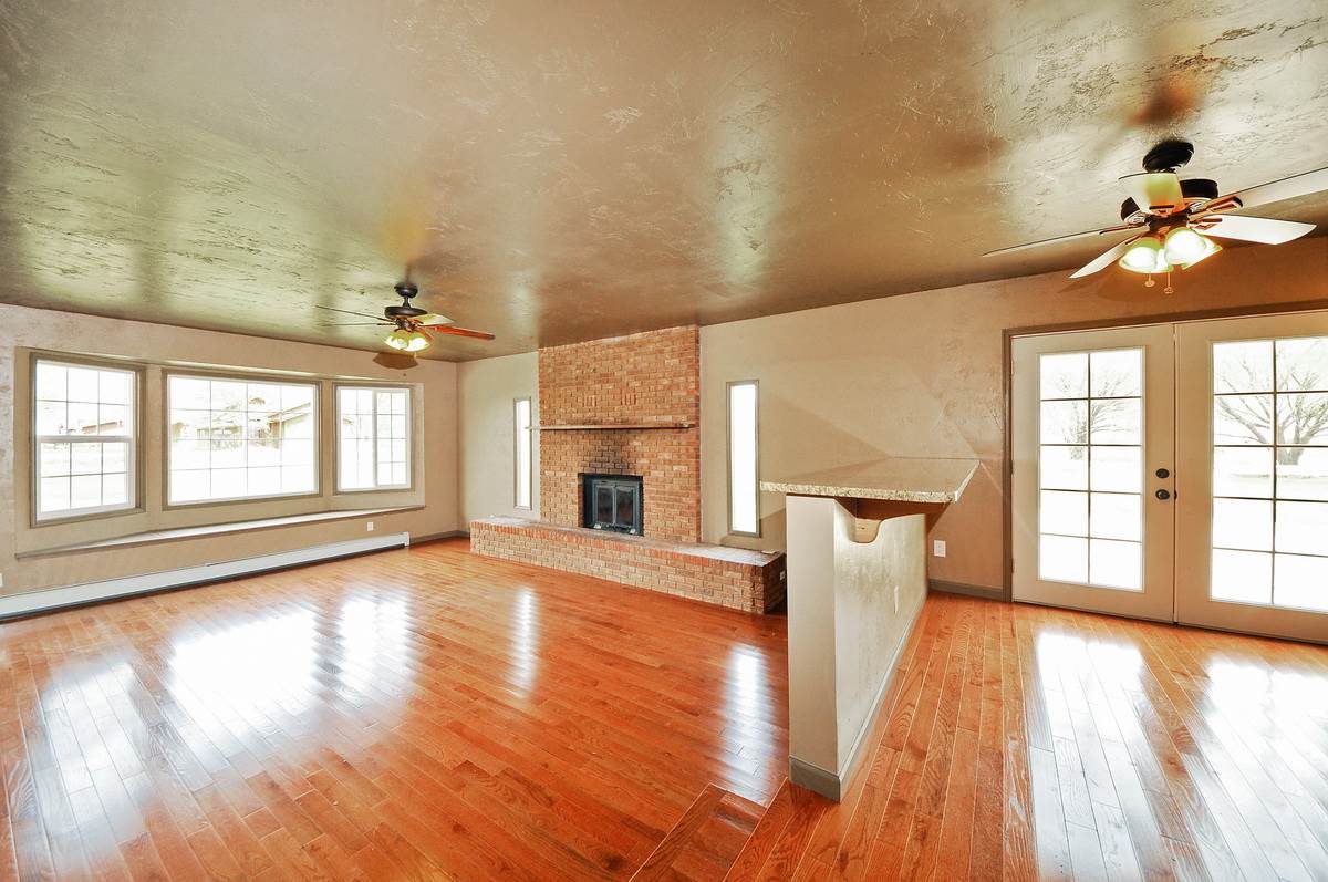 3453 1/2 G Road Clifton, CO 81520 - Photo 4 of 21 wooden floor in an empty room with a window