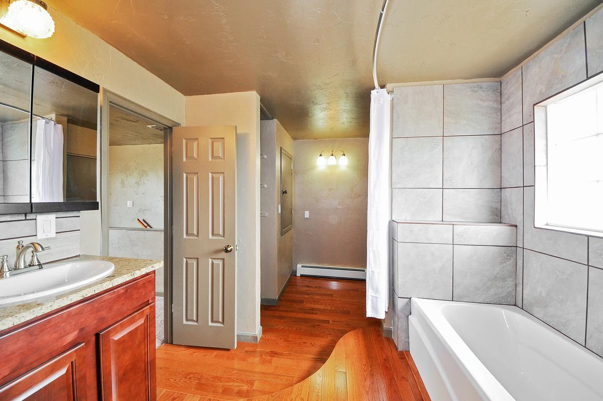 3453 1/2 G Road Clifton, CO 81520 - Photo 9 of 21 a bathroom with a tub and shower