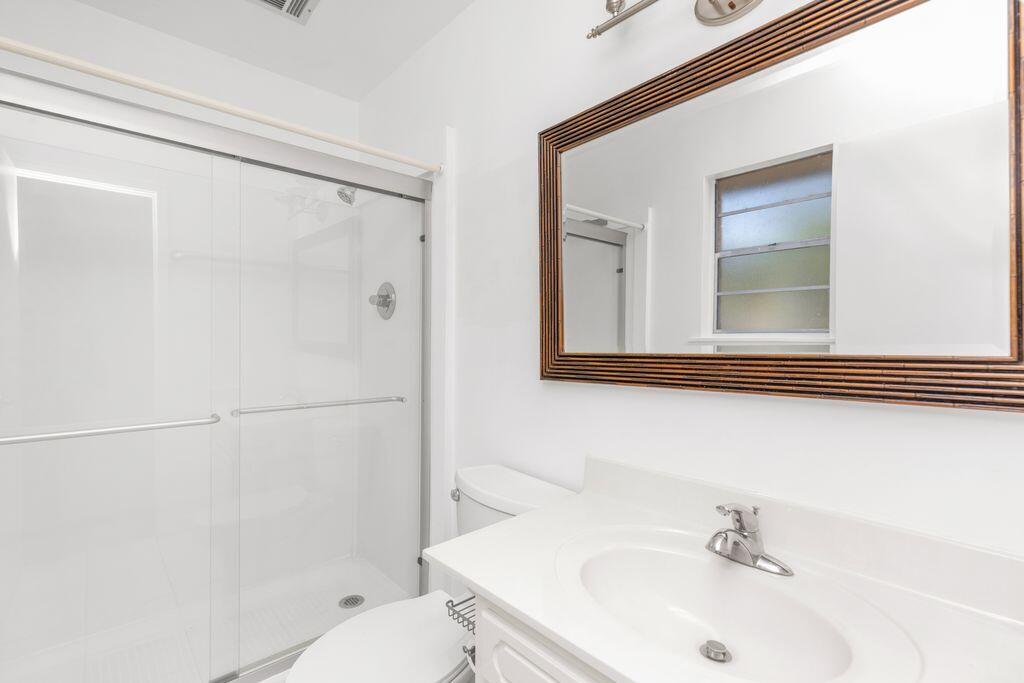 1313 Finck Road Niceville, FL 32578 - Photo 12 of 16 a bathroom with a sink and a mirror