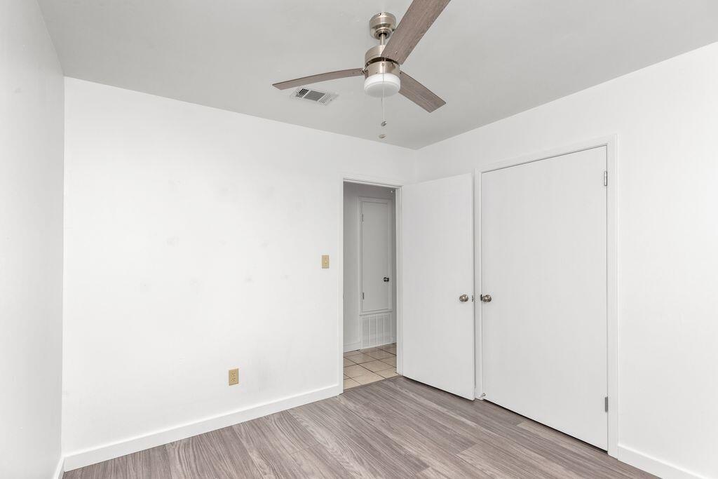 1313 Finck Road Niceville, FL 32578 - Photo 8 of 16 wooden floor in an empty room