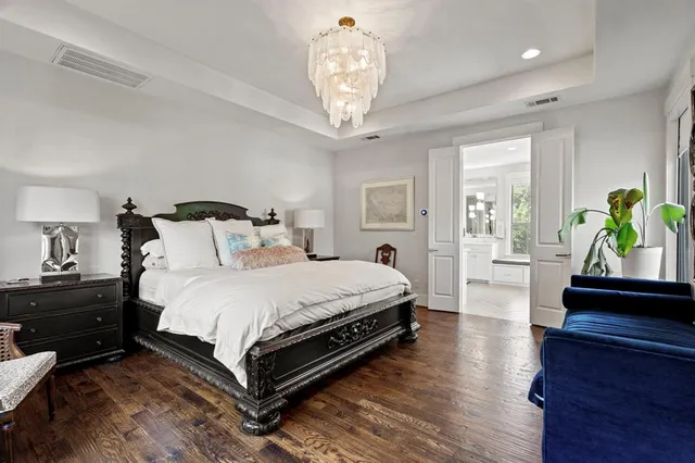 a bedroom with bed and a window