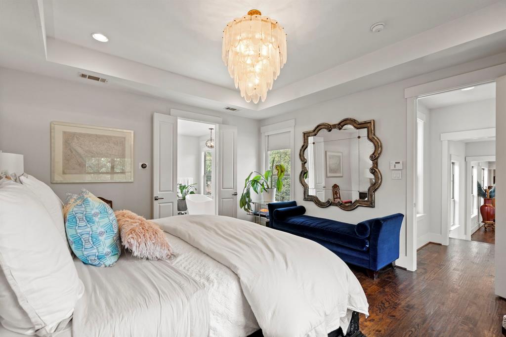 7102 Coronado Avenue Dallas, TX 75214 - Photo 13 of 30 a bedroom with bed and a table