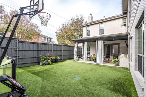 a view of a house with a yard and sitting area