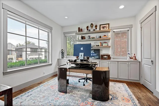 a dining room with table and chairs