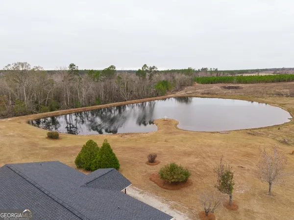 a view of a lake with a big yard