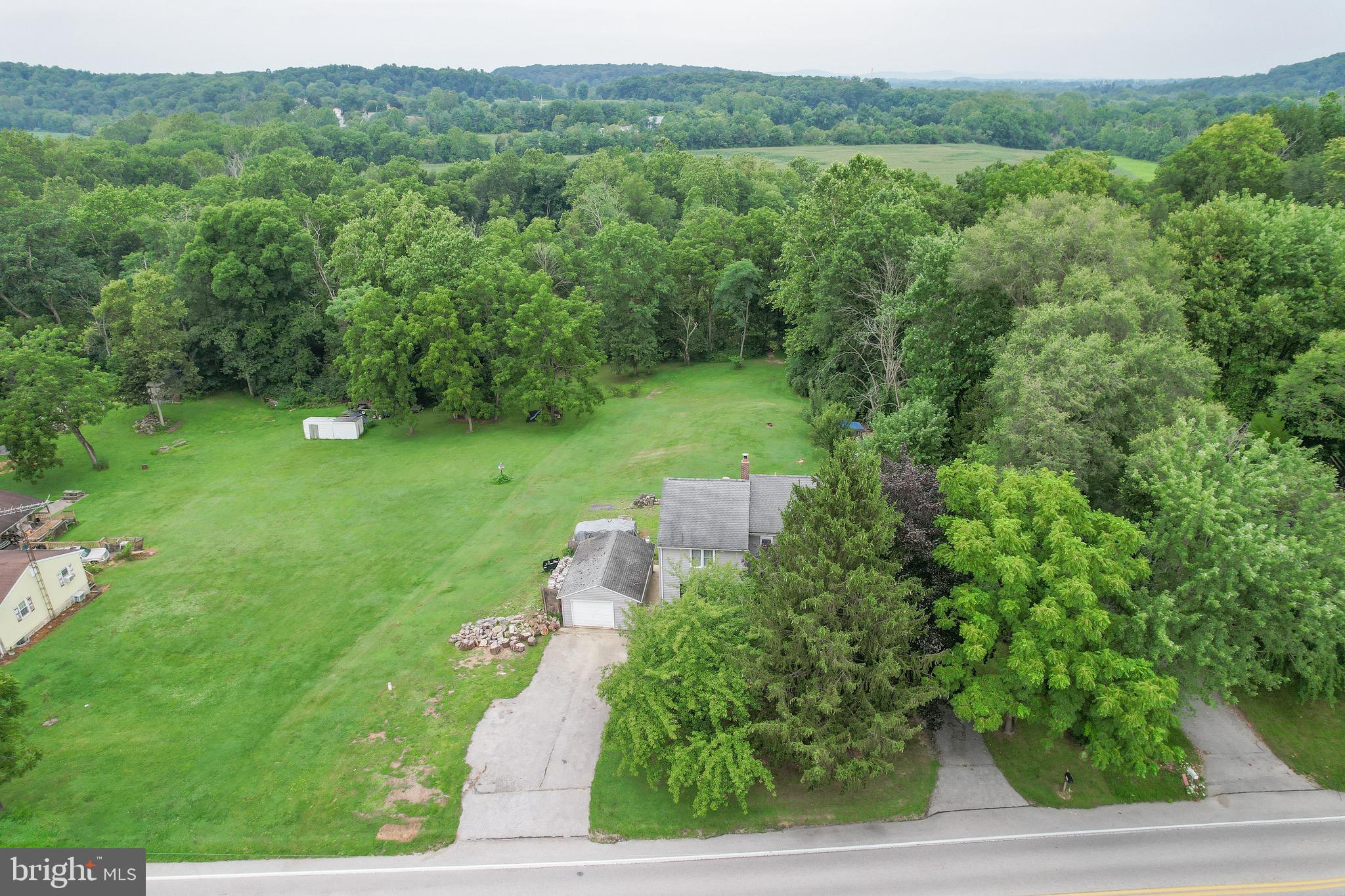 410 Days Mill Road York, PA 17403 - Photo 11 of 38 a view of a garden with a lake
