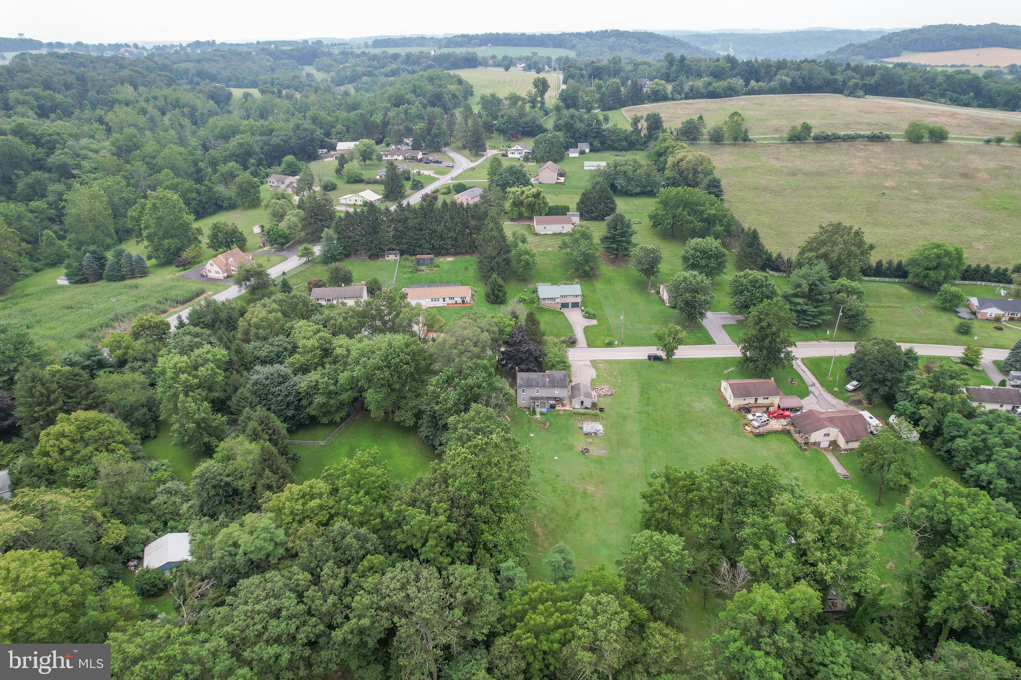 410 Days Mill Road York, PA 17403 - Photo 13 of 38 an aerial view of residential houses with outdoor space and trees