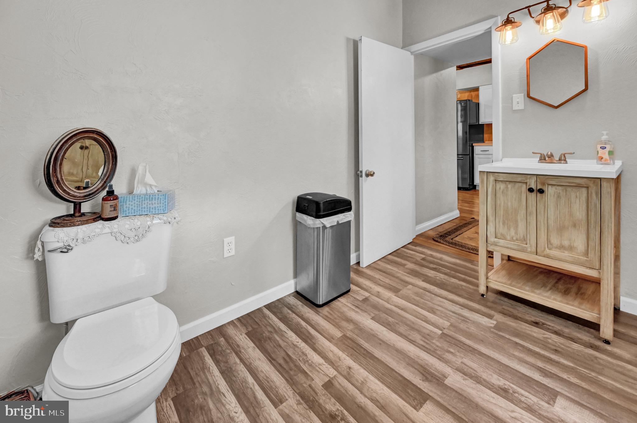 410 Days Mill Road York, PA 17403 - Photo 25 of 38 a bathroom with a toilet a sink and mirror