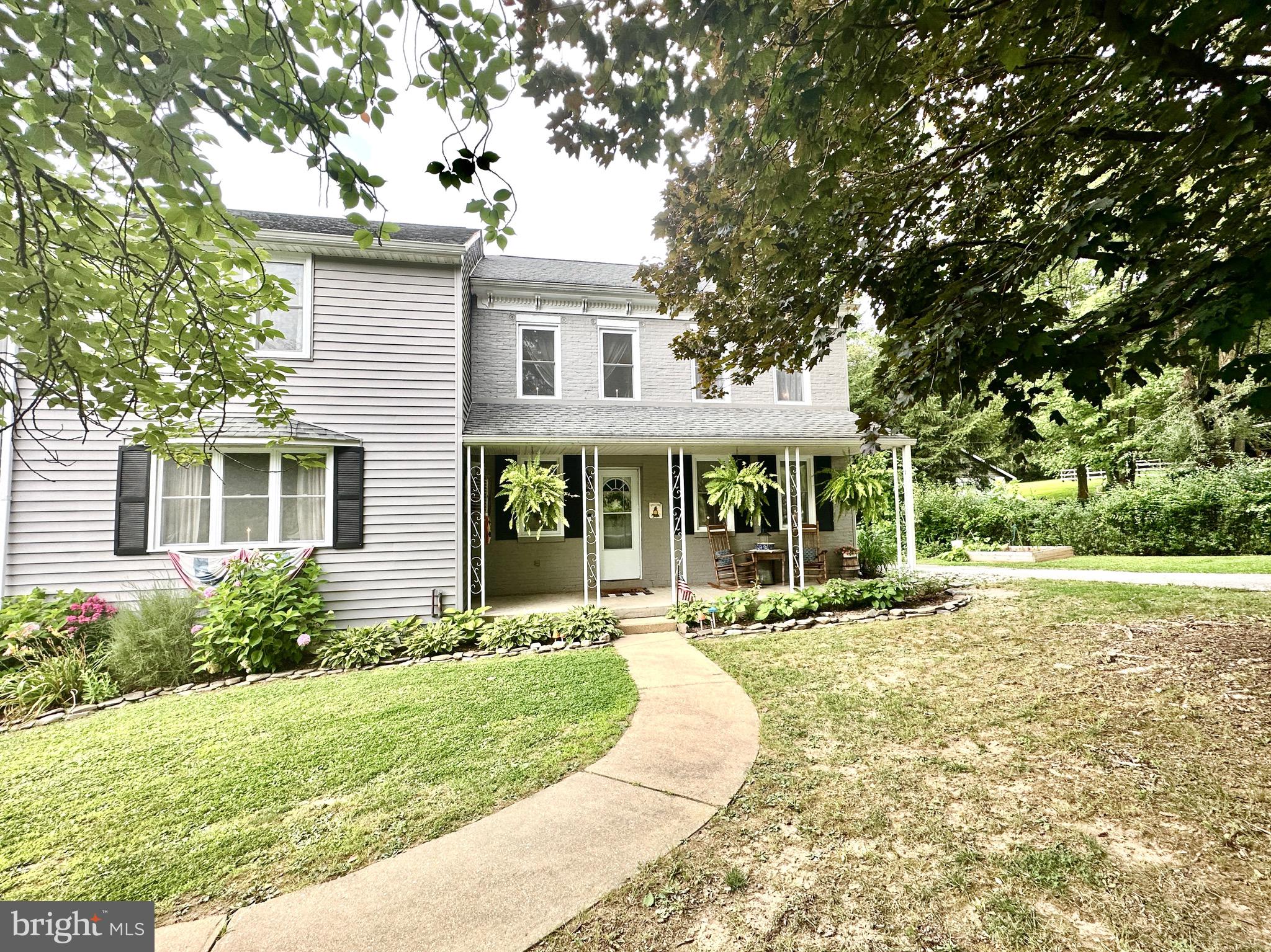 410 Days Mill Road York, PA 17403 - Photo 3 of 38 a front view of a house with a yard