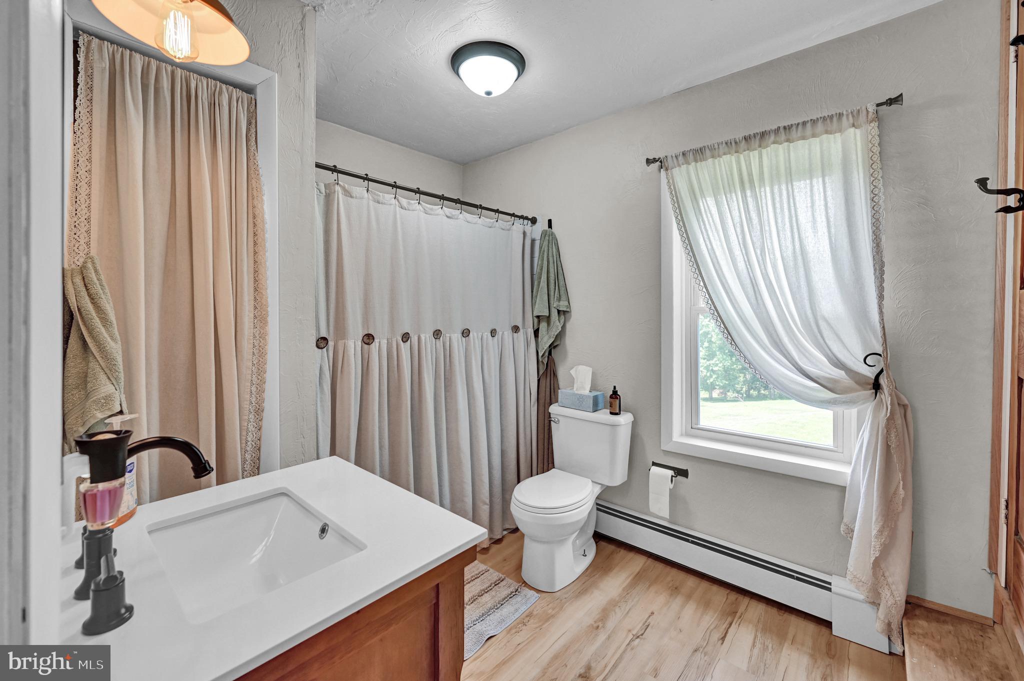 410 Days Mill Road York, PA 17403 - Photo 33 of 38 a bathroom with a sink toilet a mirror and tub