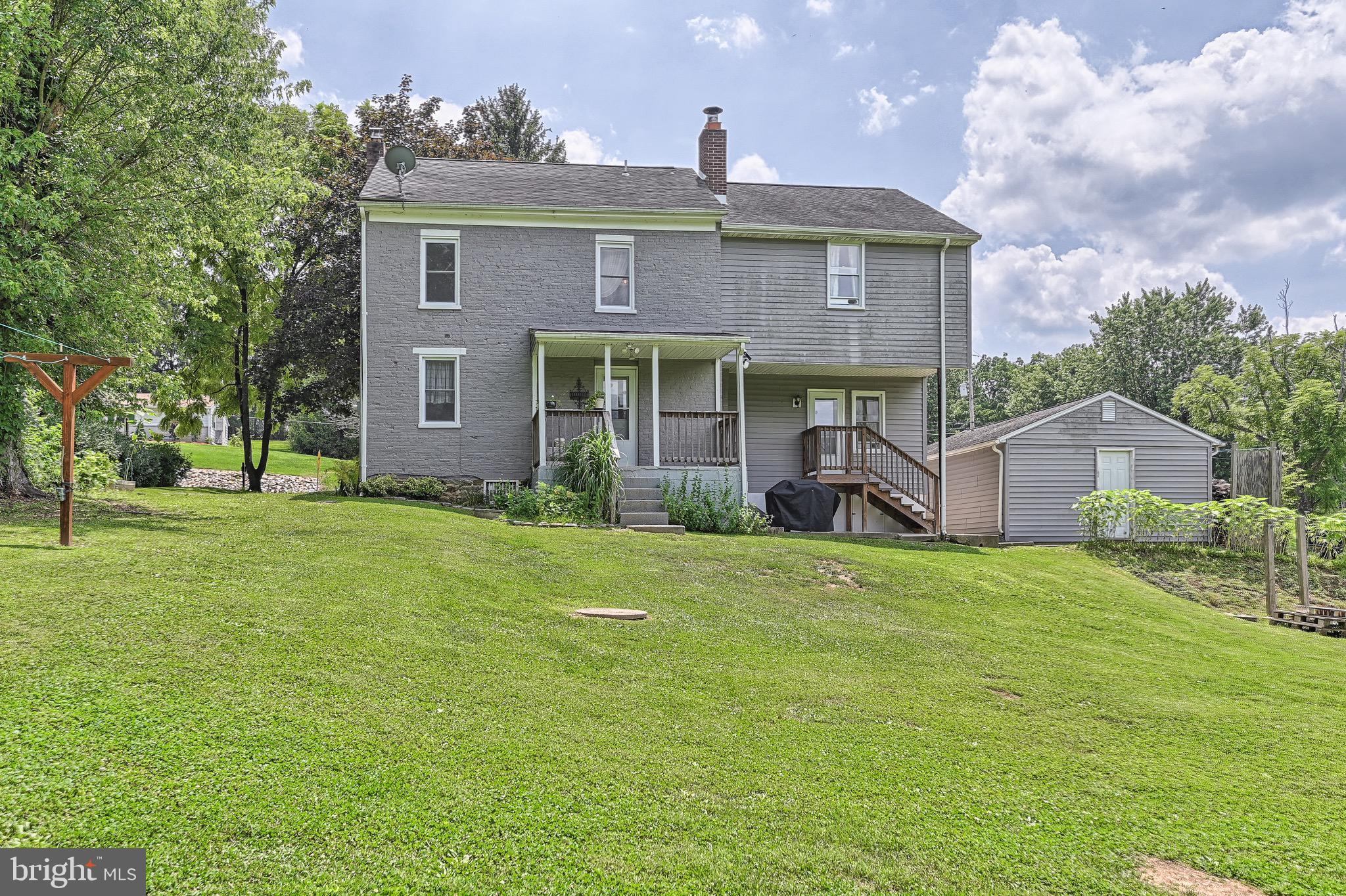410 Days Mill Road York, PA 17403 - Photo 7 of 38 a front view of a house with garden
