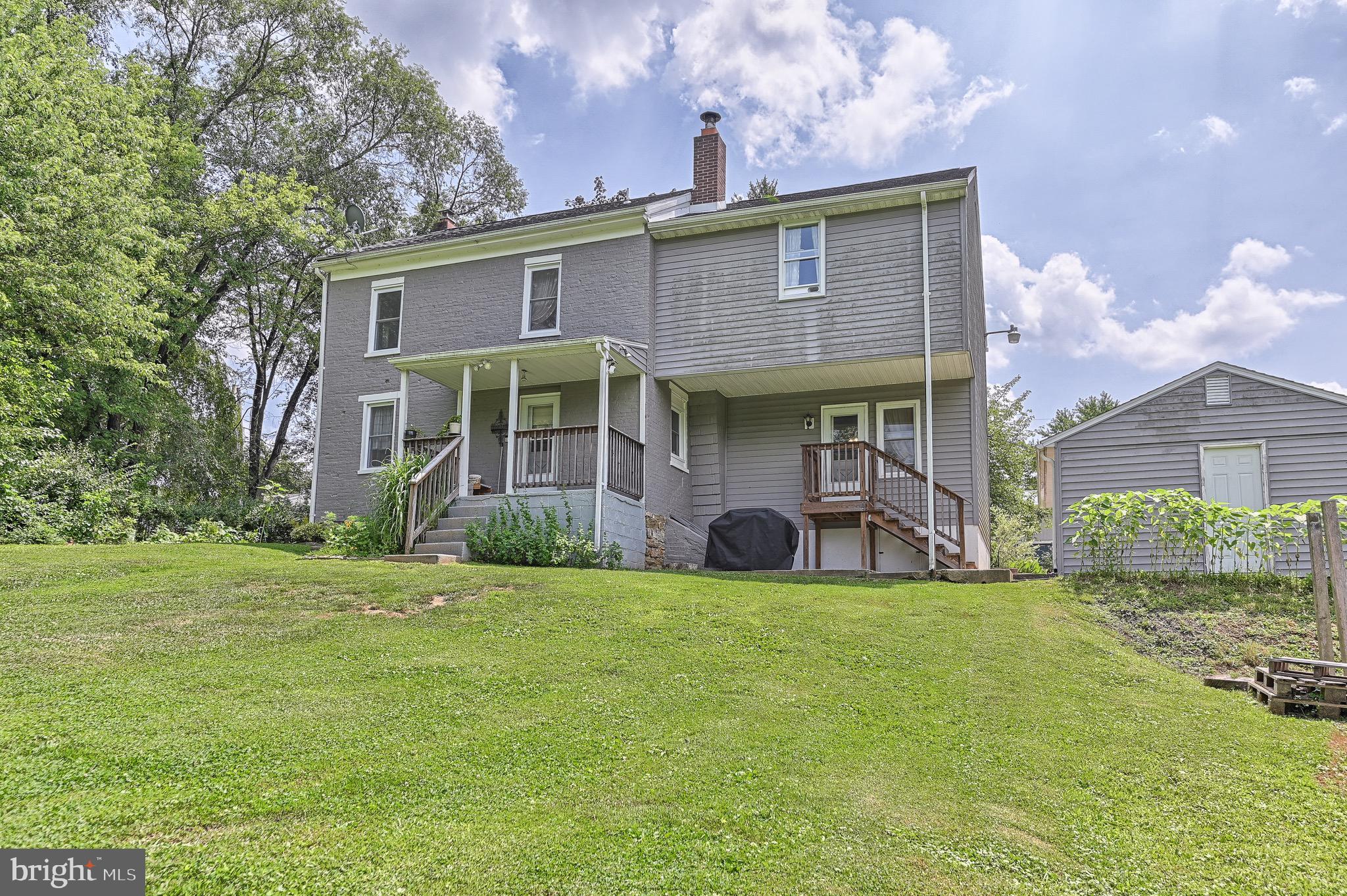 410 Days Mill Road York, PA 17403 - Photo 8 of 38 a view of a house with a yard and sitting area