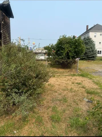 a view of a large body of water with a building in the background