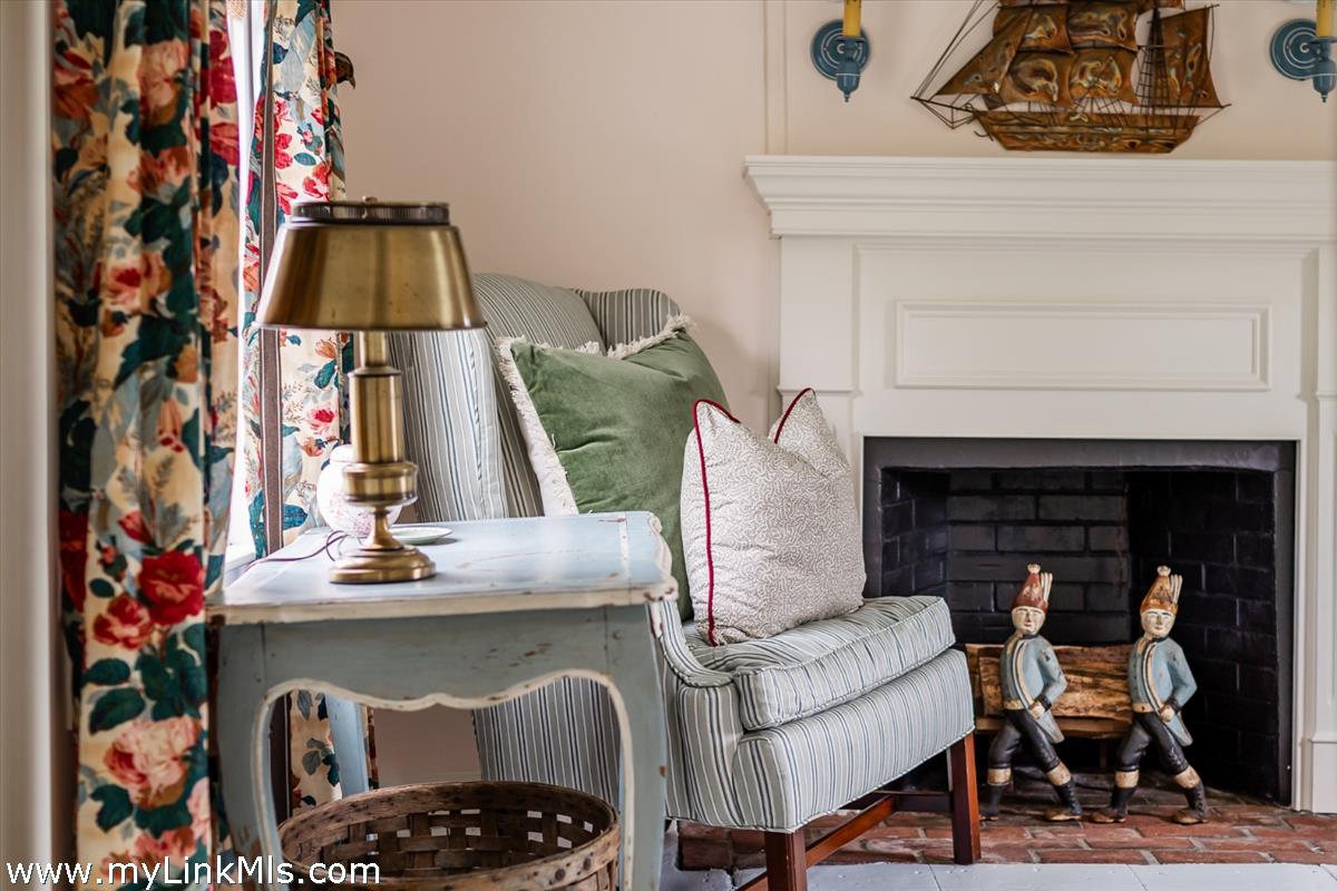 10 Centre Street Nantucket, MA 02554 - Photo 22 of 43 a living room with furniture and a fireplace