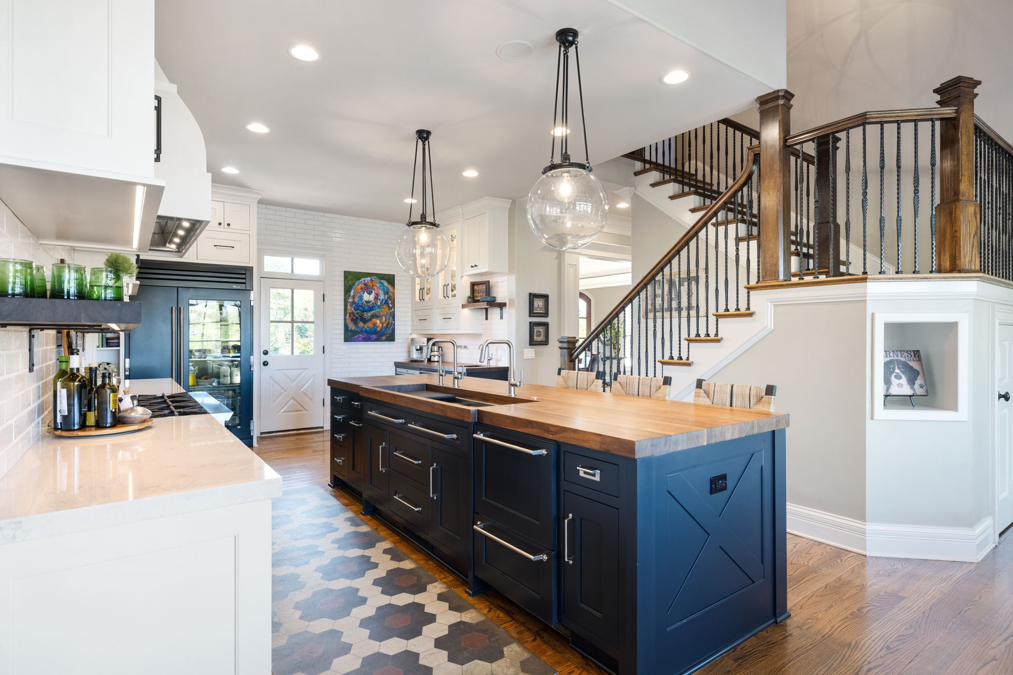4219 Two Rivers Lane Franklin, TN 37069 - Photo 17 of 69 a kitchen with stainless steel appliances kitchen island granite countertop a stove a sink and a refrigerator