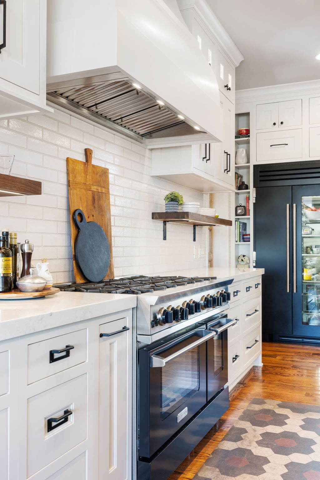 4219 Two Rivers Lane Franklin, TN 37069 - Photo 20 of 69 a kitchen with stainless steel appliances granite countertop a stove and a microwave