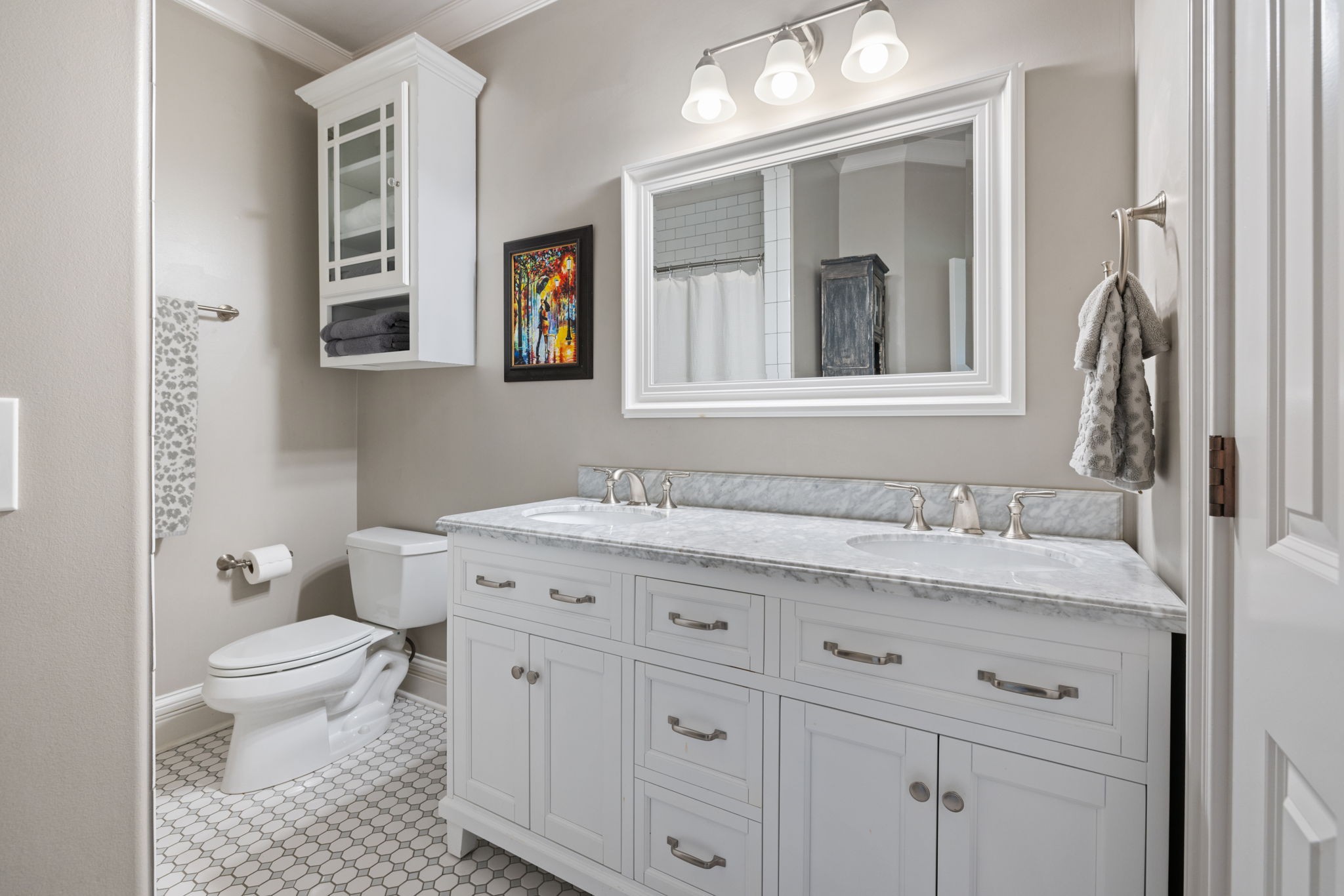 4219 Two Rivers Lane Franklin, TN 37069 - Photo 44 of 69 a bathroom with a granite countertop toilet a sink a mirror and a window