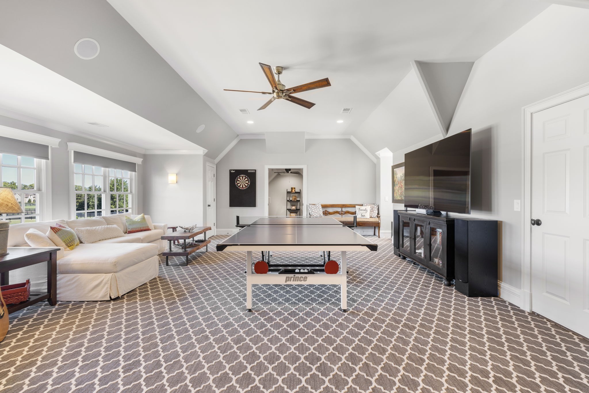 4219 Two Rivers Lane Franklin, TN 37069 - Photo 47 of 69 a living room with furniture and a flat screen tv