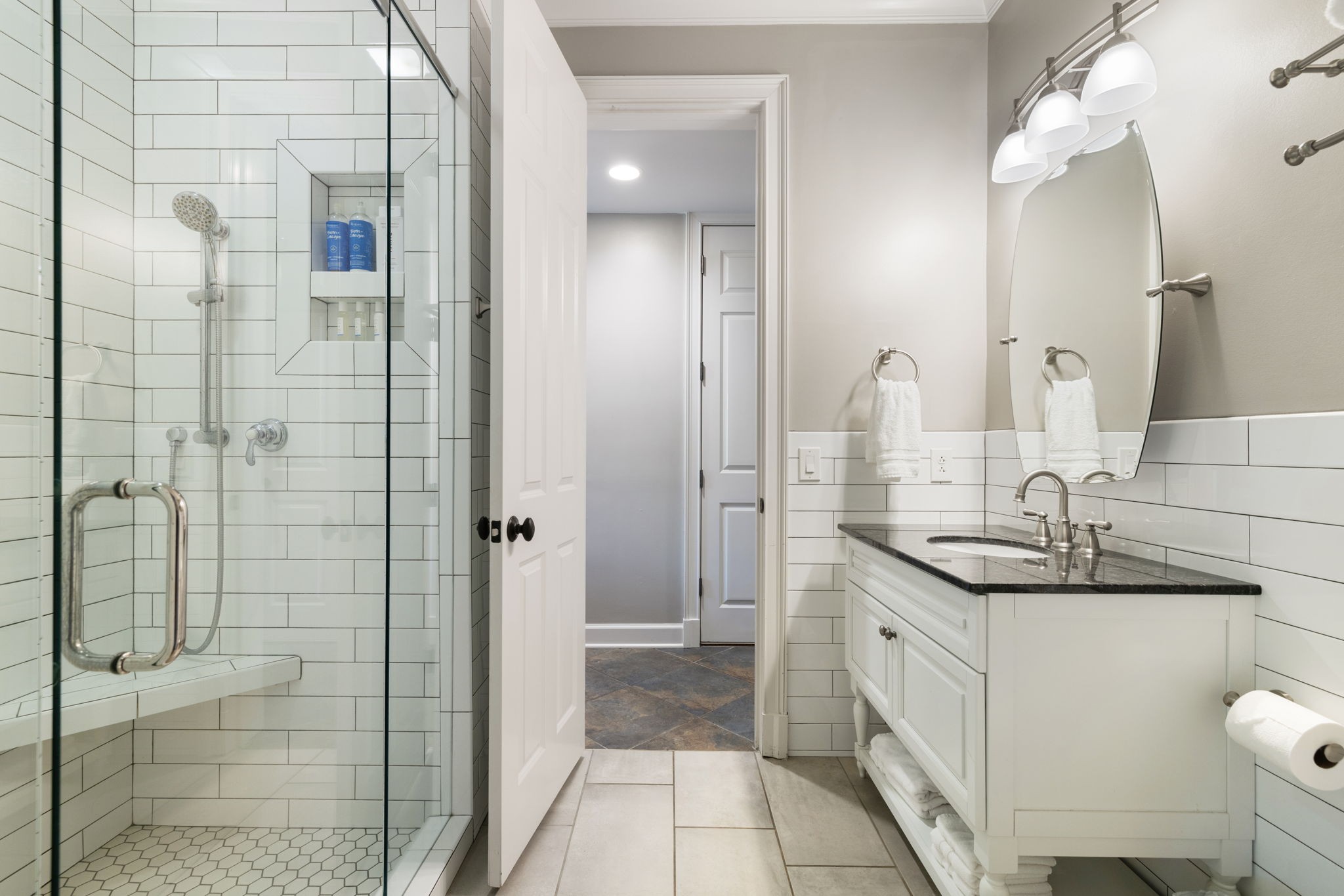 4219 Two Rivers Lane Franklin, TN 37069 - Photo 50 of 69 a bathroom with a granite countertop sink a toilet and shower