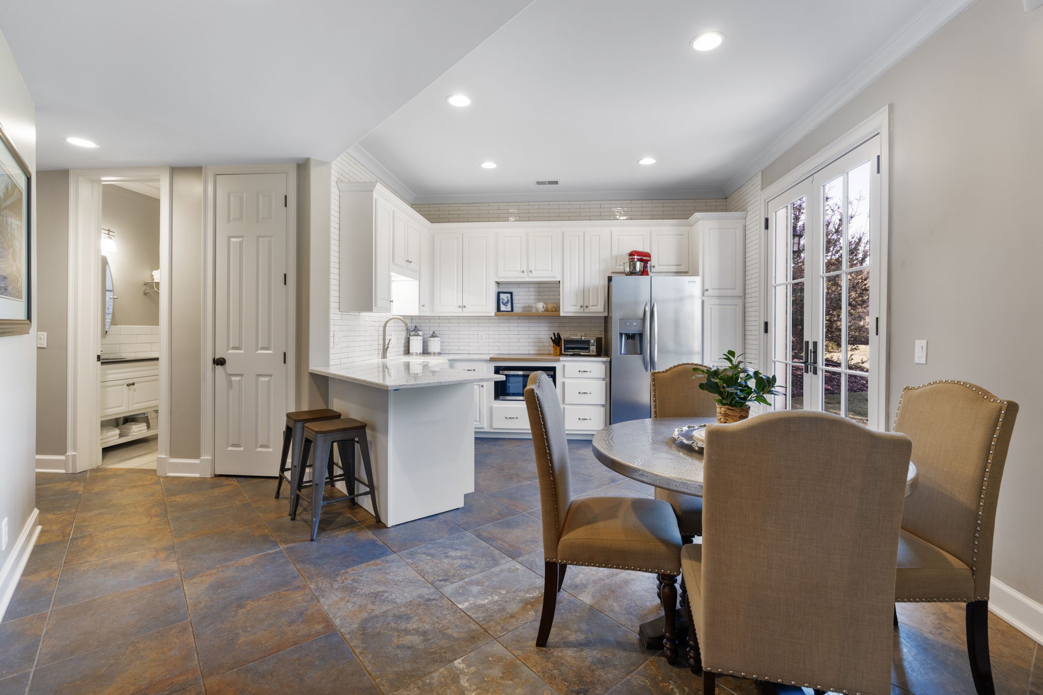 4219 Two Rivers Lane Franklin, TN 37069 - Photo 51 of 69 a living room with furniture and a dining table with kitchen view