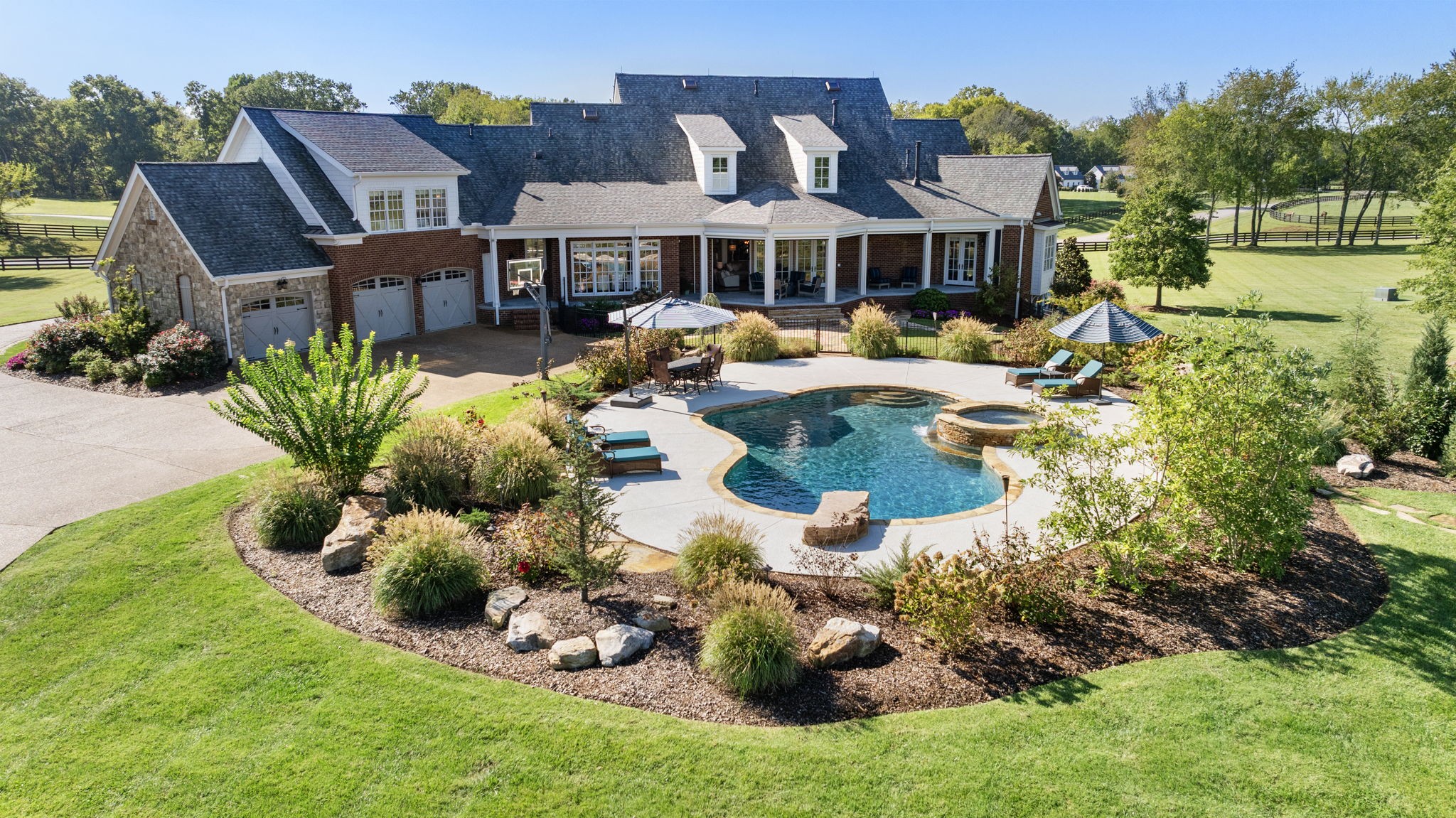 4219 Two Rivers Lane Franklin, TN 37069 - Photo 56 of 69 a view of a house with backyard outdoor seating and swimming pool